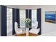Cozy breakfast nook with a glass table and natural light at 10747 Satinwood Cir, Orlando, FL 32825