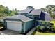 Charming two-story home featuring a well-manicured lawn and a two-car garage at 10747 Satinwood Cir, Orlando, FL 32825