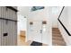 Bright foyer featuring a staircase, modern accents, and a welcoming entrance at 10747 Satinwood Cir, Orlando, FL 32825