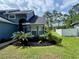 Charming home features a well-manicured front yard with mature landscaping at 10747 Satinwood Cir, Orlando, FL 32825