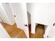 Hallway with laminate flooring and white walls, with a closet at 10747 Satinwood Cir, Orlando, FL 32825