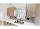 Bright kitchen features modern cabinets, stainless steel sink, and sleek countertops at 10747 Satinwood Cir, Orlando, FL 32825