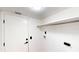 Bright laundry room with washer and dryer hookups and a hanging rack at 10747 Satinwood Cir, Orlando, FL 32825