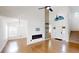 Bright living room boasts high ceilings, modern fireplace, and hardwood floors at 10747 Satinwood Cir, Orlando, FL 32825