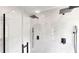 Modern shower with rainfall showerhead, handheld sprayer, and sleek glass enclosure at 10747 Satinwood Cir, Orlando, FL 32825