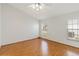 Bedroom with laminate flooring, large windows and a ceiling fan at 10828 Cherry Oak Cir, Orlando, FL 32817