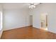 Large bedroom with laminate flooring, ceiling fan, and an ensuite bathroom at 10828 Cherry Oak Cir, Orlando, FL 32817