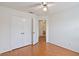 A well-lit bedroom with wood floors and a large closet at 10828 Cherry Oak Cir, Orlando, FL 32817