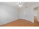 A well-lit bedroom with wood floors and a ceiling fan at 10828 Cherry Oak Cir, Orlando, FL 32817