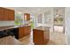 Functional kitchen featuring granite countertops, stainless steel appliances, and an island for meal preparation at 10828 Cherry Oak Cir, Orlando, FL 32817