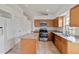Well-lit kitchen with granite countertops, an island, and stainless steel appliances at 10828 Cherry Oak Cir, Orlando, FL 32817