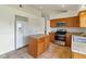 Efficient kitchen featuring an island, stainless steel appliances, and ample cabinet space, perfect for cooking at 10828 Cherry Oak Cir, Orlando, FL 32817