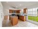 Well-lit kitchen with stainless steel appliances, granite countertops, and tiled floors, perfect for cooking at 10828 Cherry Oak Cir, Orlando, FL 32817