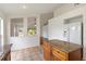 Bright kitchen featuring an island with granite countertops and light brown cabinets at 10828 Cherry Oak Cir, Orlando, FL 32817
