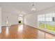 Bright, open-concept living room with large windows and laminate flooring, creating a welcoming space at 10828 Cherry Oak Cir, Orlando, FL 32817