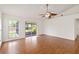 Living room with laminate flooring and sliding glass doors to the screened lanai at 10828 Cherry Oak Cir, Orlando, FL 32817