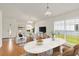 Bright living room with hardwood floors, large windows, and contemporary furnishings at 10828 Cherry Oak Cir, Orlando, FL 32817