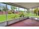 Relaxing screened porch with views of the lush backyard and beautiful greenery at 10828 Cherry Oak Cir, Orlando, FL 32817