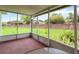 The screened lanai provides a tranquil retreat with a view of the brick-walled backyard and mature landscaping at 10828 Cherry Oak Cir, Orlando, FL 32817