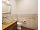 Elegant powder room featuring a glass bowl sink, decorative backsplash, and modern fixtures at 11106 Coniston Way, Windermere, FL 34786