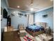A blue themed bedroom with airplane decor, ceiling fan and window at 11106 Coniston Way, Windermere, FL 34786