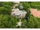 An aerial view of the home with mature trees providing privacy to the property at 11106 Coniston Way, Windermere, FL 34786