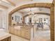 Gourmet kitchen with farmhouse sink, granite countertops, and open layout to the living area at 11106 Coniston Way, Windermere, FL 34786