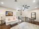 Open living room with a large ceiling fan, sofa, area rug and a nearby dining table at 11106 Coniston Way, Windermere, FL 34786