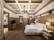 A spacious main bedroom with wood floors, decorative ceiling, and paneled walls at 11106 Coniston Way, Windermere, FL 34786