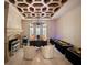 Luxurious home office featuring a custom ceiling design, fireplace, and ample desk space at 11106 Coniston Way, Windermere, FL 34786