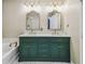 Primary bathroom features double sinks, tub and shower combo at 1275 Shallcross Ave, Orlando, FL 32828