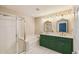 Primary bathroom featuring double sinks, soaking tub and glass enclosed shower at 1275 Shallcross Ave, Orlando, FL 32828