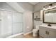 Neutral bathroom with glass enclosed shower and vanity with updated hardware at 1275 Shallcross Ave, Orlando, FL 32828