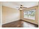 Bedroom with wood floors, ceiling fan and lots of natural light at 1275 Shallcross Ave, Orlando, FL 32828