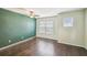 Bedroom with beautiful floors, natural light and accent wall at 1275 Shallcross Ave, Orlando, FL 32828