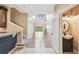 Bright foyer leads to living area and half bath, showcasing hardwood floors and staircase at 1275 Shallcross Ave, Orlando, FL 32828