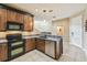 Well-equipped kitchen featuring stainless steel appliances, granite countertops, and stylish cabinetry at 1275 Shallcross Ave, Orlando, FL 32828