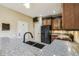 Granite countertops and stainless steel appliances give a modern feel to this kitchen at 1275 Shallcross Ave, Orlando, FL 32828