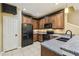 Kitchen features granite countertops, stainless steel sink, and matching appliances at 1275 Shallcross Ave, Orlando, FL 32828