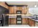 Spacious kitchen with granite countertops, stainless steel appliances, and ample cabinet space at 1275 Shallcross Ave, Orlando, FL 32828
