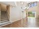 Bright living room with beautiful wood floors, high ceilings, and staircase at 1275 Shallcross Ave, Orlando, FL 32828