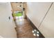 Open-concept living room boasts hardwood floors, high ceilings, a ceiling fan, and access to the backyard at 1275 Shallcross Ave, Orlando, FL 32828