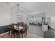 Open-concept dining room featuring tile floors, decorative lighting, and a smooth transition to the living room at 14680 Yorkshire Run Dr, Orlando, FL 32828