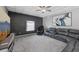 Spacious living room featuring a coffered ceiling, gray walls, and plush gray carpeting at 14680 Yorkshire Run Dr, Orlando, FL 32828