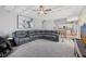 Open living room with a coffered ceiling, neutral carpet, and a view into the adjacent open concept kitchen at 14680 Yorkshire Run Dr, Orlando, FL 32828