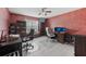 Spacious home office with dual workstations, stylish decor, and hardwood floors at 14680 Yorkshire Run Dr, Orlando, FL 32828