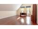 Spacious bedroom featuring hardwood floors, natural light from two windows, and built in desk with storage at 1477 Shadwell Cir, Lake Mary, FL 32746