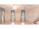 Large bedroom featuring hardwood floors, three windows with custom drapes and a ceiling fan at 1477 Shadwell Cir, Lake Mary, FL 32746