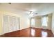 Bright bedroom with hardwood floors, a ceiling fan, and a spacious closet at 1477 Shadwell Cir, Lake Mary, FL 32746