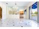 Open-concept dining area with a chandelier, mirrored wall, and easy access to the outdoor patio at 1477 Shadwell Cir, Lake Mary, FL 32746